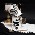 Load image into Gallery viewer, Al-Hub Calligraphy Mug with gold handle and rim by Safar London
