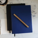 Load image into Gallery viewer, Rabbi Zidni Ilma Embossed Navy A5 Notebook by Safar London
