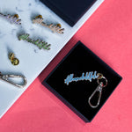 Load image into Gallery viewer, Alhamdulillah Gold Plated Hard Enamel Black Keyring by Safar London
