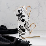 Load image into Gallery viewer, Al-Hub Calligraphy Mug with gold handle and rim by Safar London
