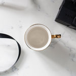 Load image into Gallery viewer, Al-Hub Calligraphy Mug with gold handle and rim by Safar London
