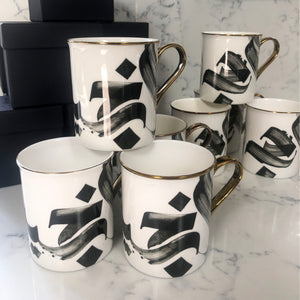 SECONDS Calligraphy Mug with gold handle and rim by Safar London